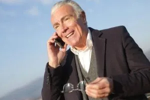 Man with restored front teeth in his mouth after full mouth reconstruction in Alexandria, VA.