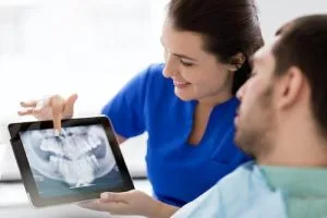 The full mouth reconstruction process is explained to address oral health issues.